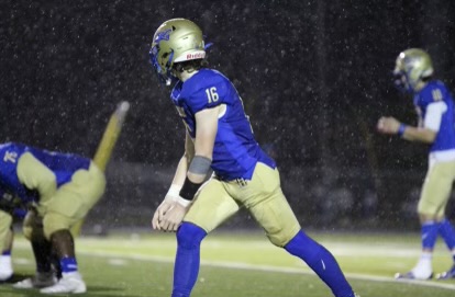 Junior Walden Cole playing football.