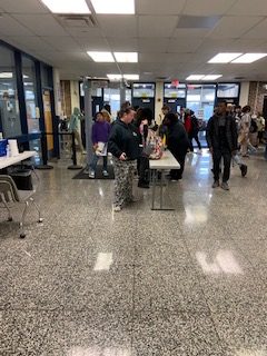 Students arrive to school during class change and go through the metal detectors in the front.