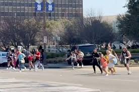 Cheerleaders and their families ran from the convention center. 