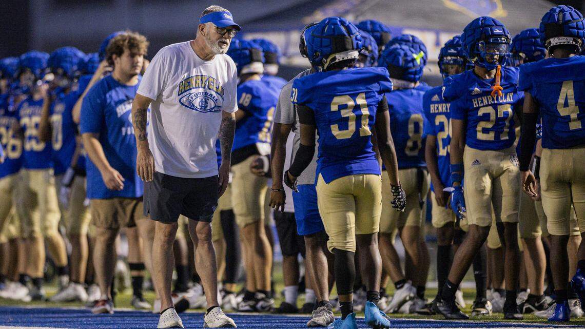 Coach Hawkins talking to his players during a preseason scrimmage.