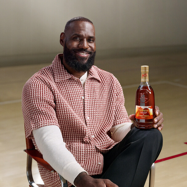 Lebron is shown holding a bottle of Hennessy his new partnership.